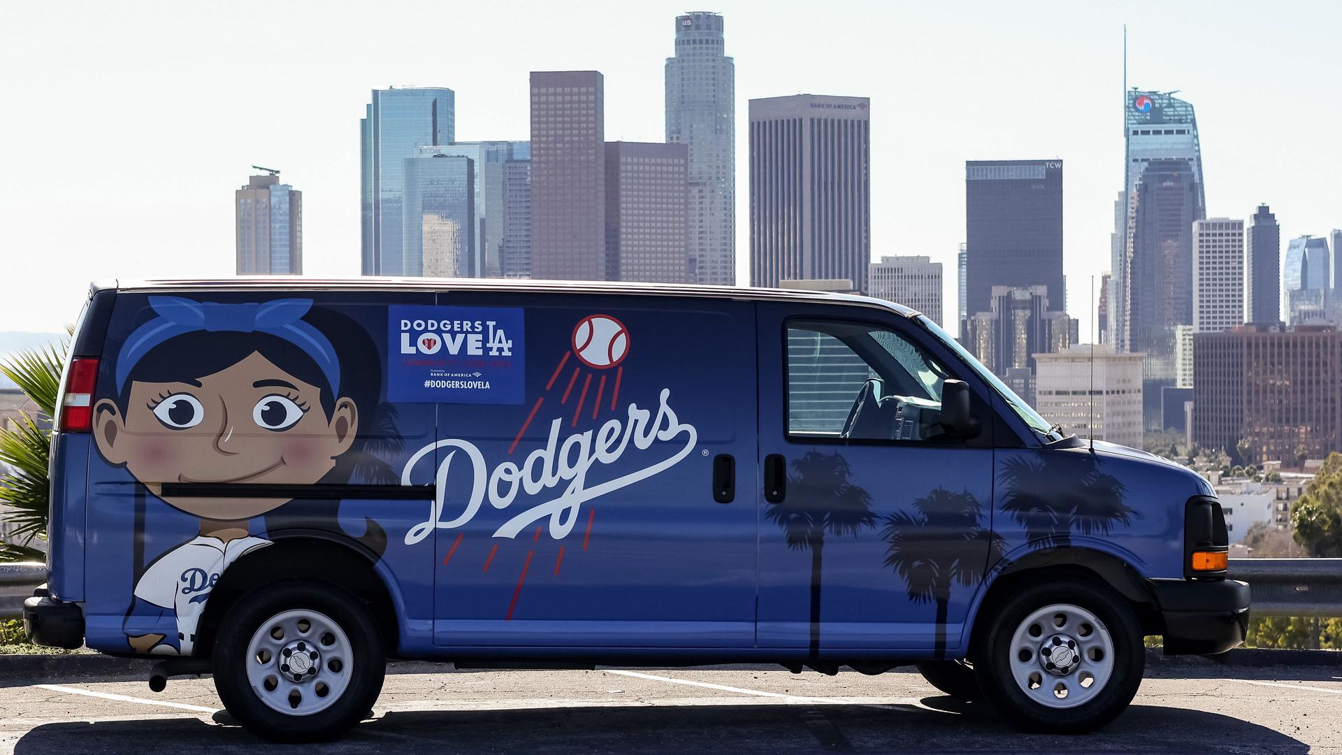 Dodgers van and L.A. skyline