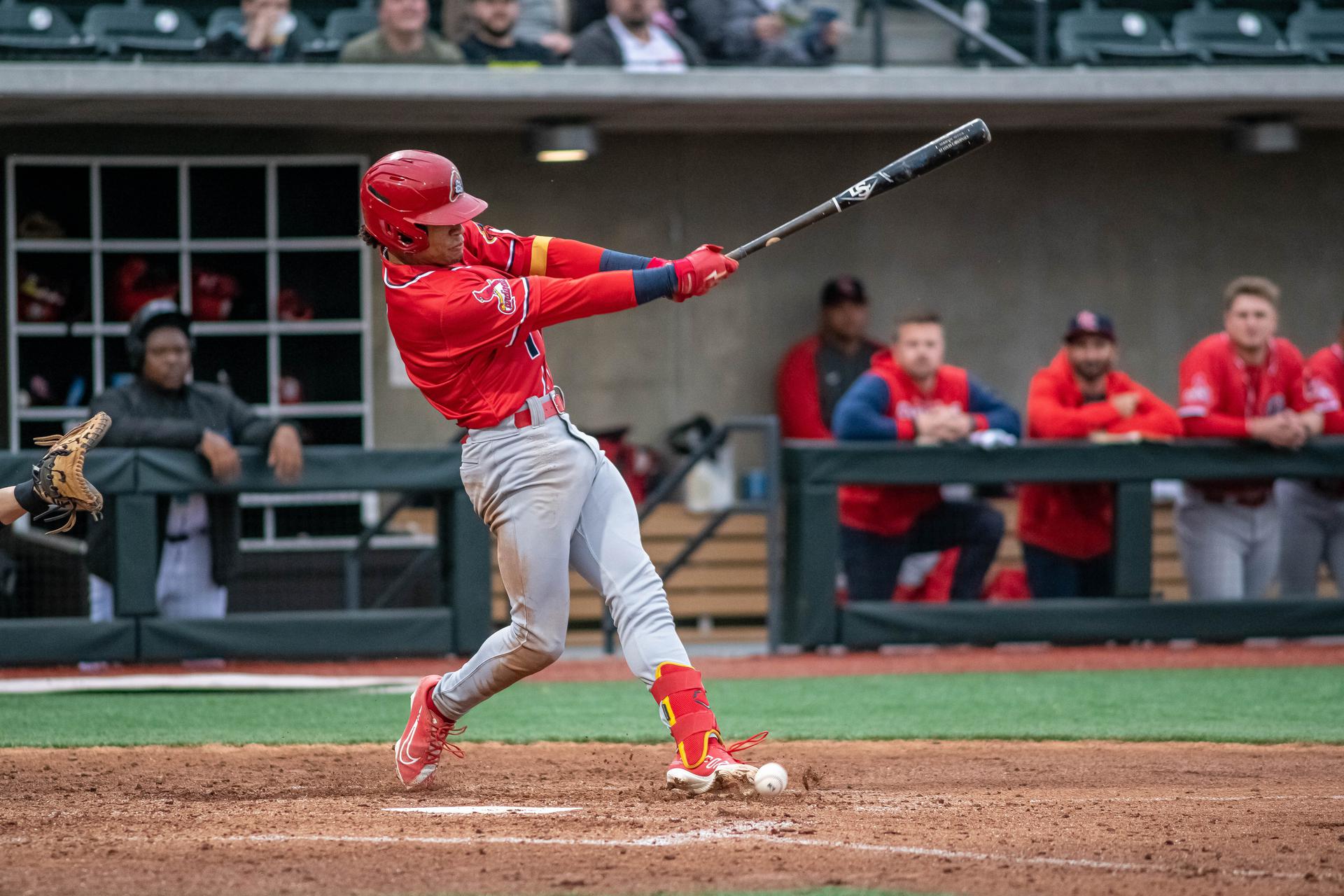 Cardinals Minor League player Masyn Winn swings the bat while wearing a red uniform