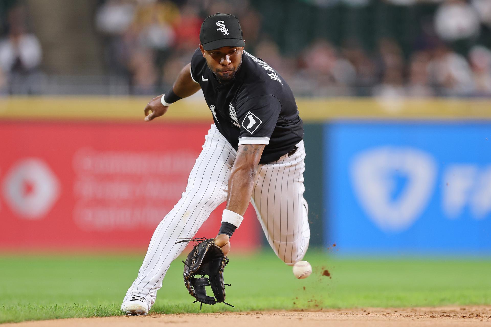 Elvis Andrus fields a ball during a game while wearing a black White Sox jersey