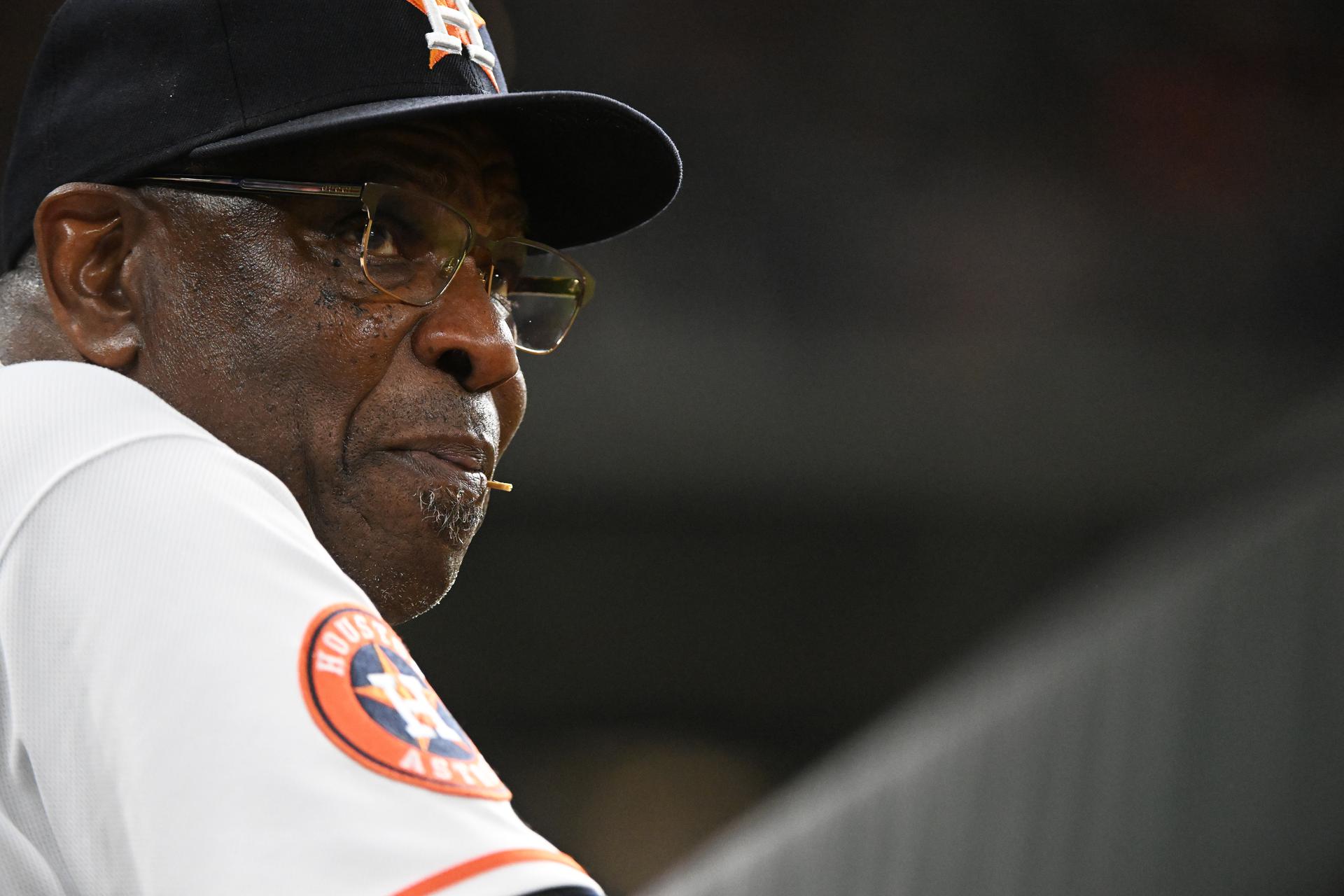 Astros manager Dusty Baker looks onto the field from the dugout