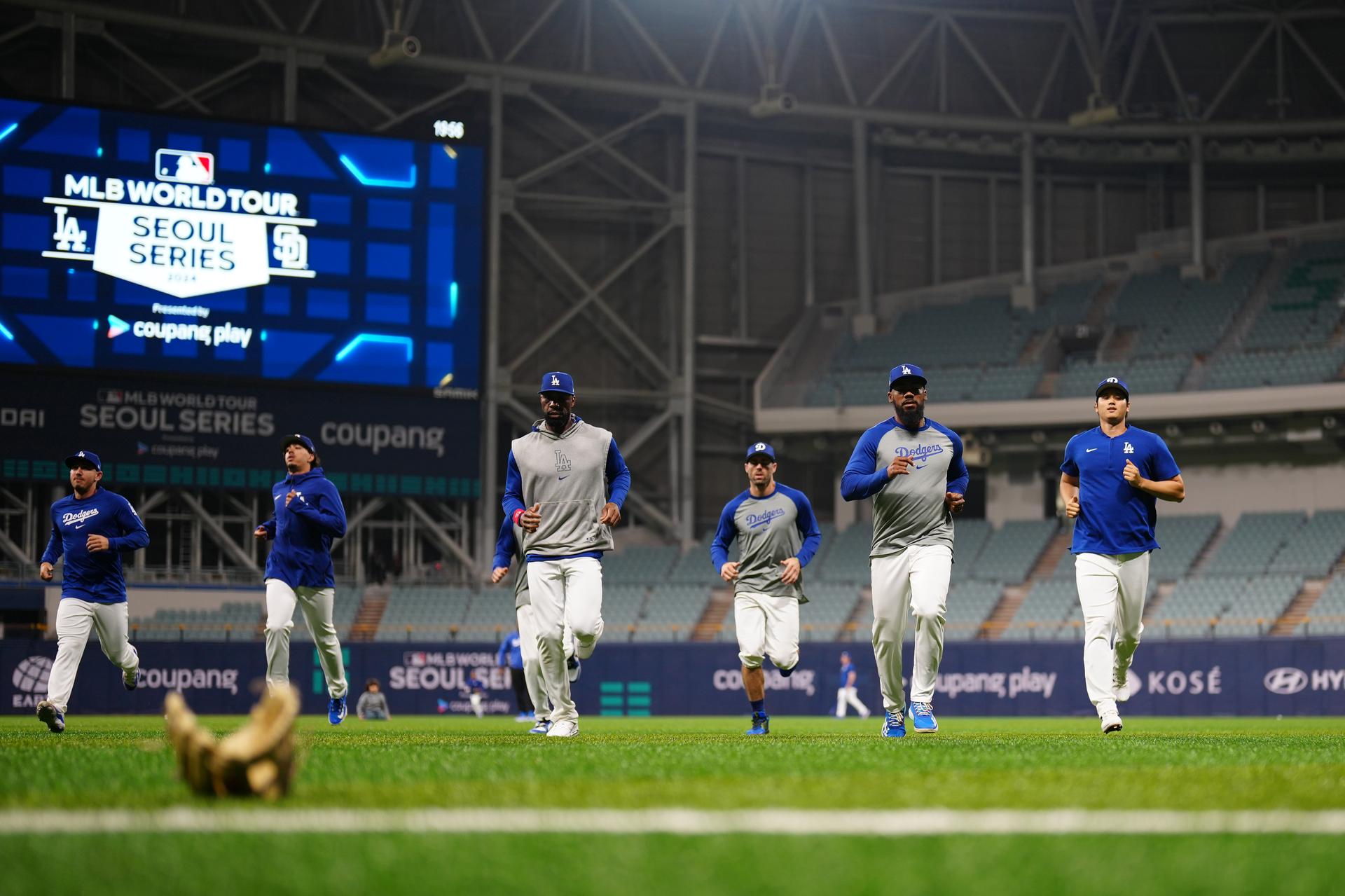 The Dodgers warming up in South Korea