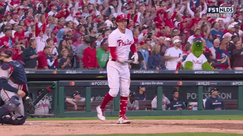 Rhys Hoskins spikes his bat after a home run