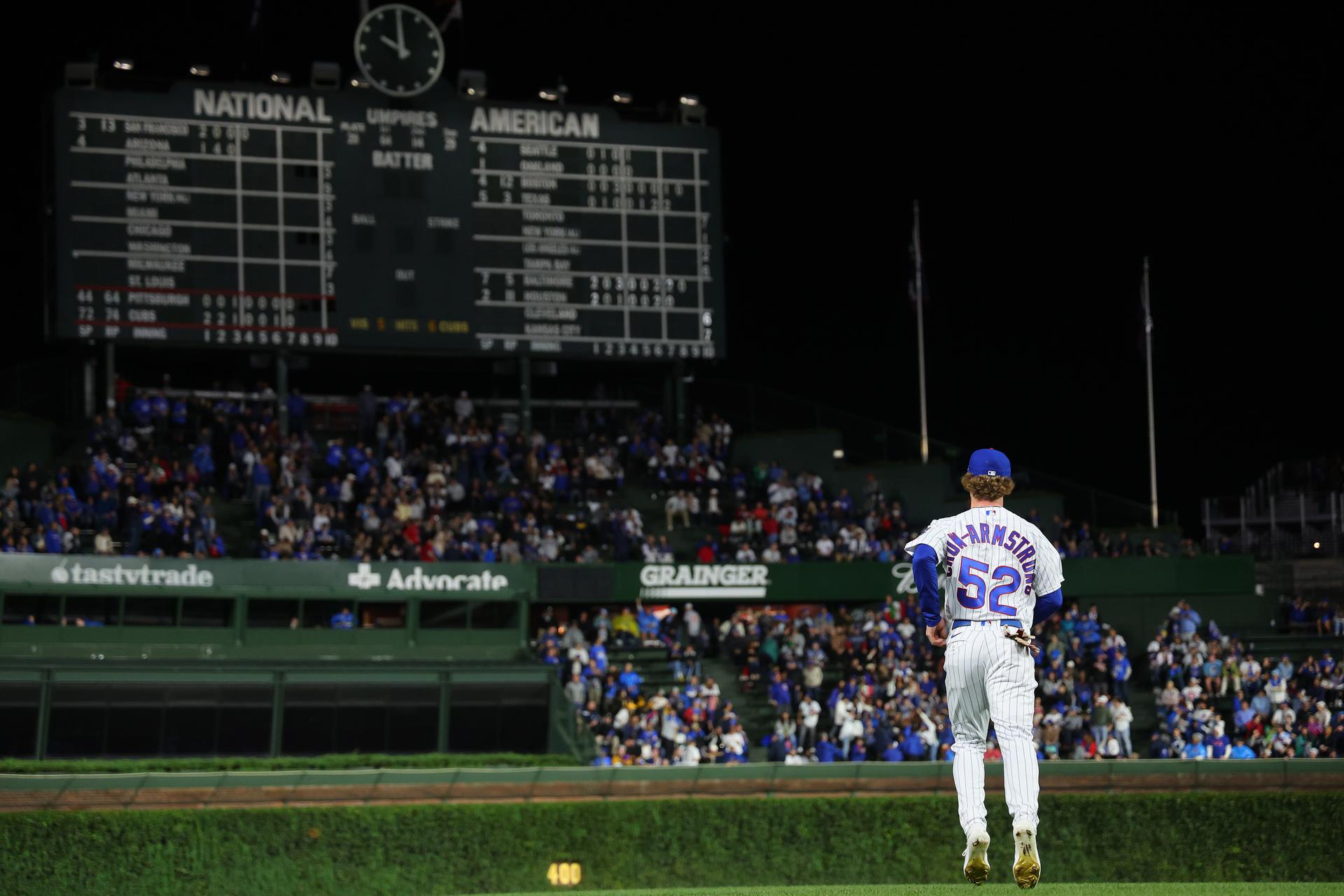 Pete Crow-Armstrong runs out to center field at Wrigley