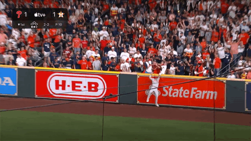 An animated GIF of Nick Castellanos holding up the baseball after a catch