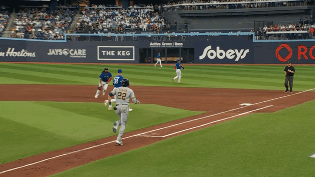 A gif of Blue Jays first baseman Vladimir Guerrero Jr. tossing his glove with ball in it to first base for an out