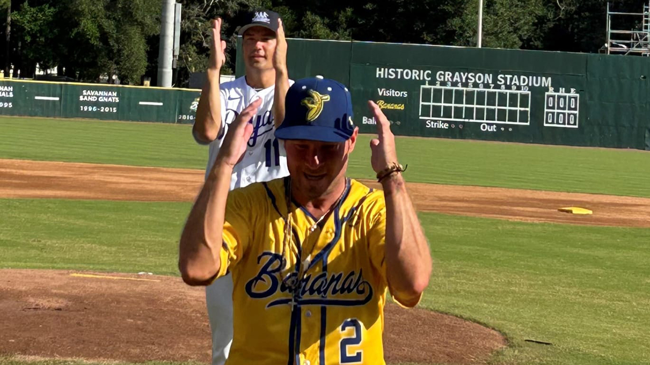 Jeremy Guthrie and Brian Littrell practice dance moves on a baseball field