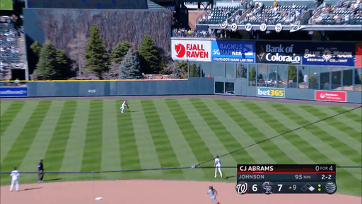 An animated gif of an outfielder making a diving catch