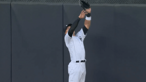 An animated gif of Aaron Judge leaping to catch a ball over the wall