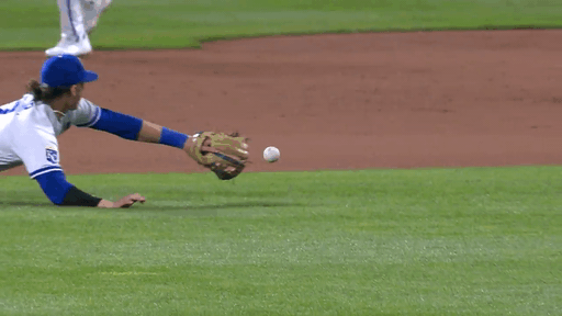 An animated gif of Bobby Witt Jr. diving for a ground ball and getting up to throw