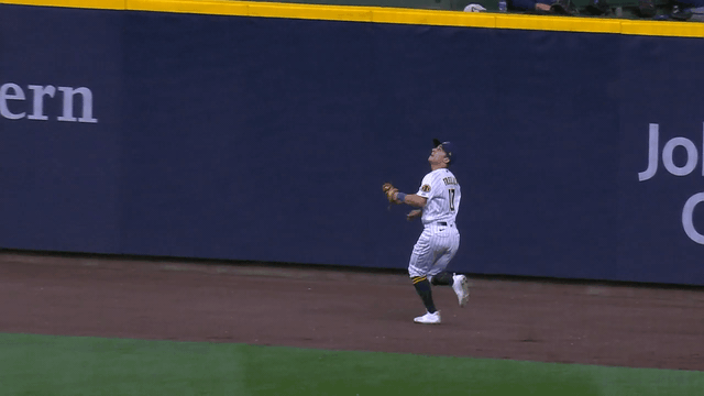 An animated gif of Sal Frelick making a leaping catch against the wall