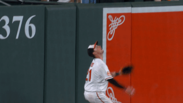 An animated gif of Austin Hays robbing a home run
