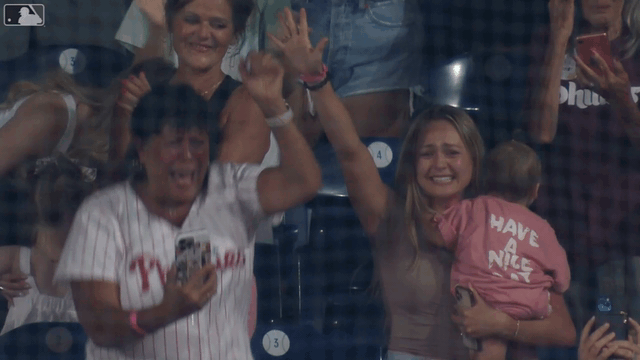 An animated gif of two women jumping up and down, celebrating