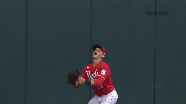 An animated gif of T.J. Friedl robbing a home run
