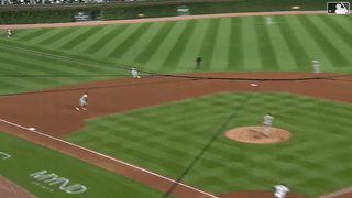 An animated gif of Jordan Lawlar making a sliding stop at shortstop and spinning for a strong throw