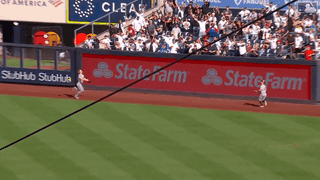 An animated gif of Sal Frelick making a leaping catch against the fence