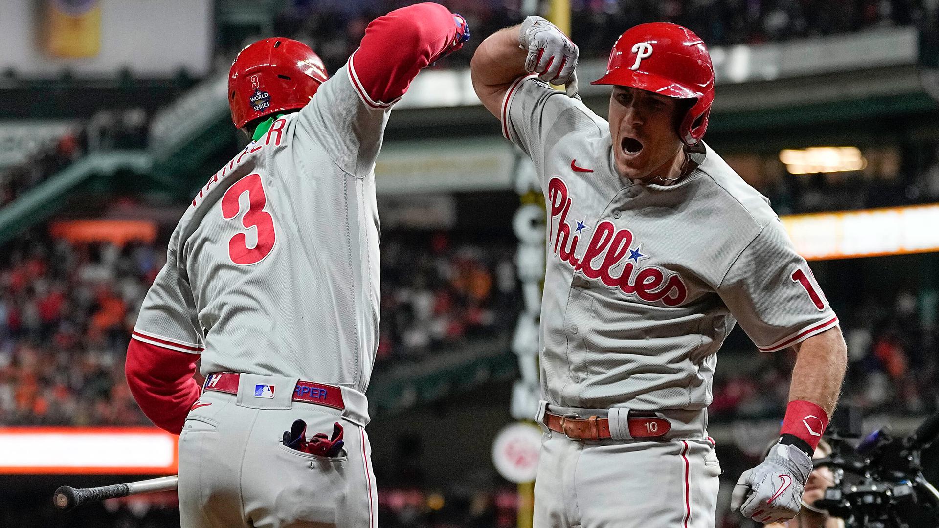 Bryce Harper and J.T. Realmuto bash forearms after a home run