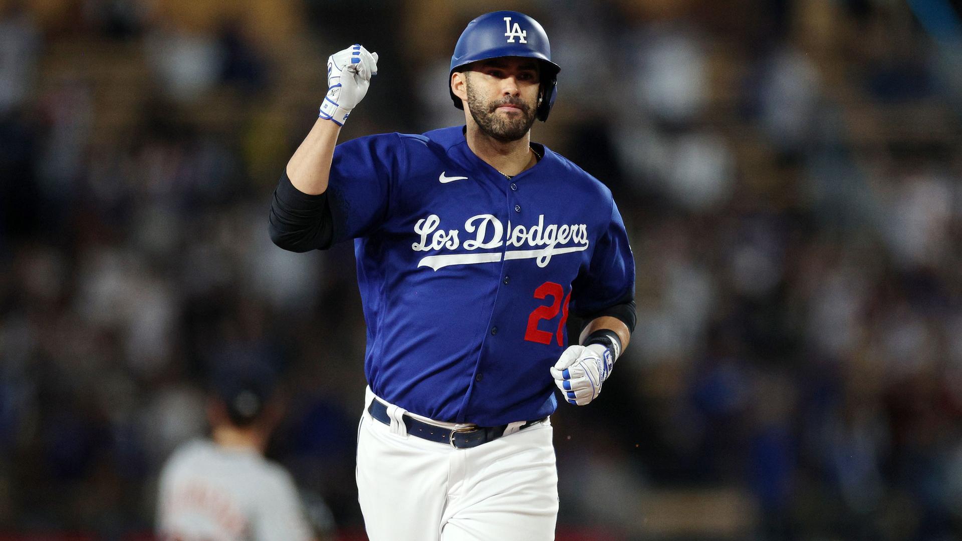 J.D. Martinez pumps his fist as he rounds the bases