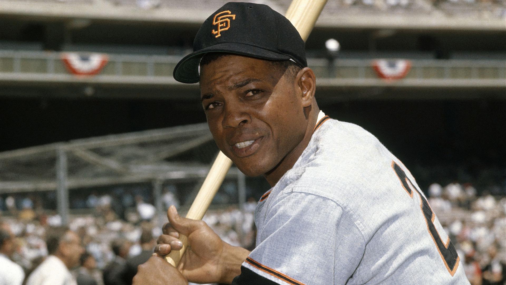 Willie Mays poses, bat in hands, in a vintage photo