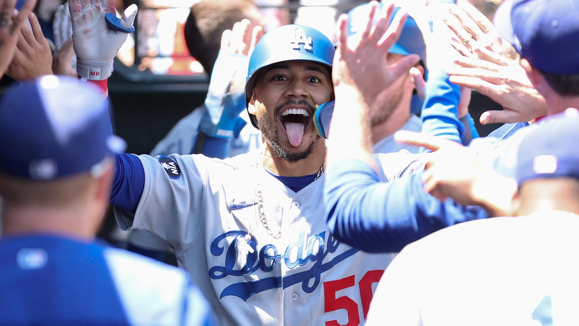 Mookie Betts celebrates in Dodgers dugout