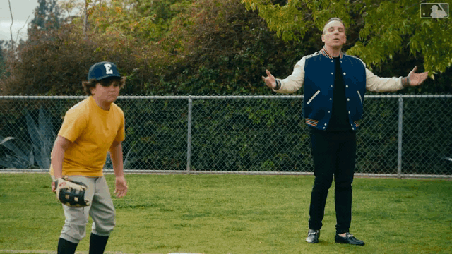 An animated gif shows a man gesturing toward a young baseball player