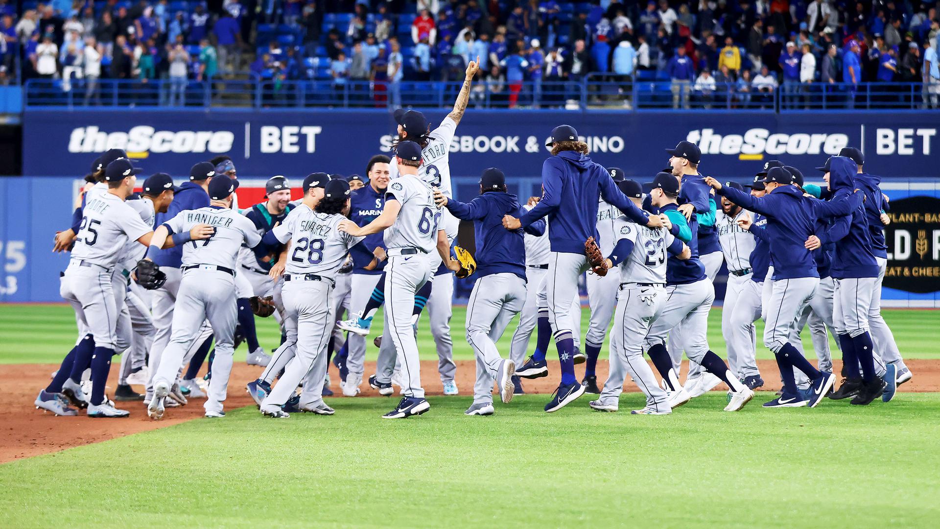 The Seattle Mariners celebrate a win on the field