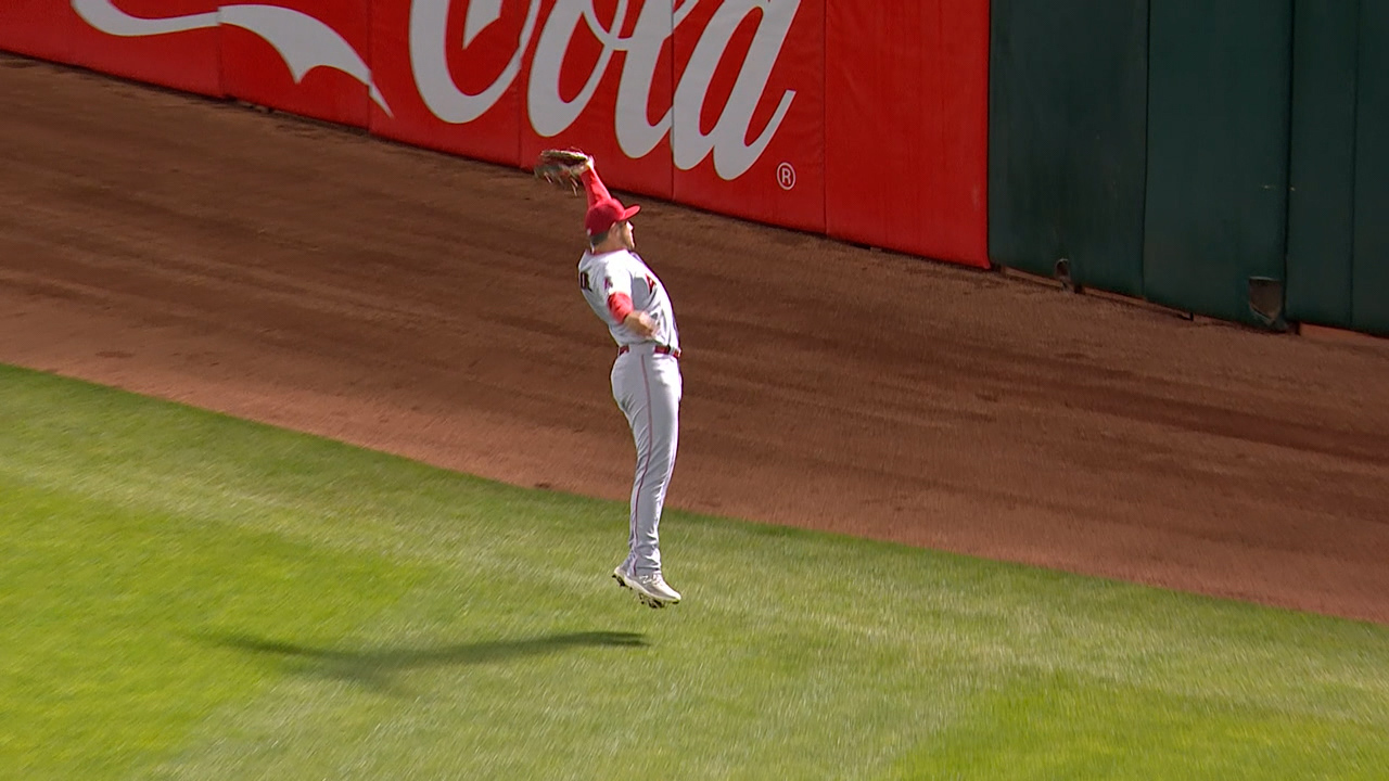 Hunter Renfroe lunges to make a catch facing the right-field wall