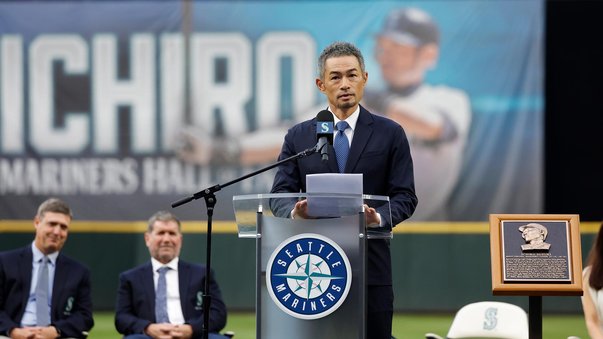 Ichiro Suzuki stands at a podium