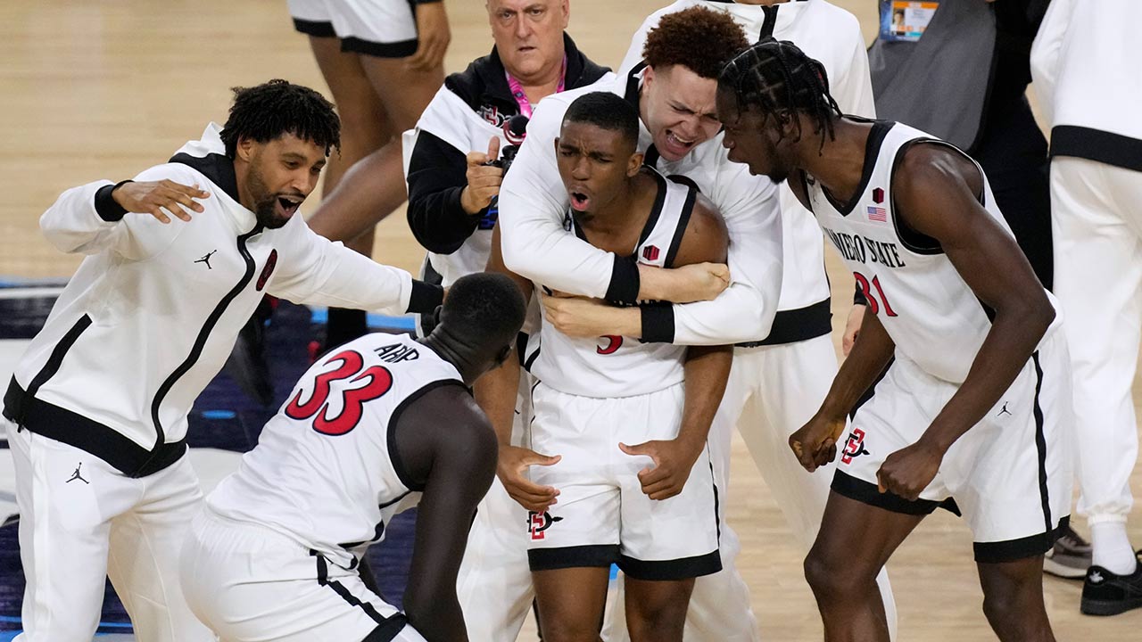 San Diego State basketball players celebrate after a victory