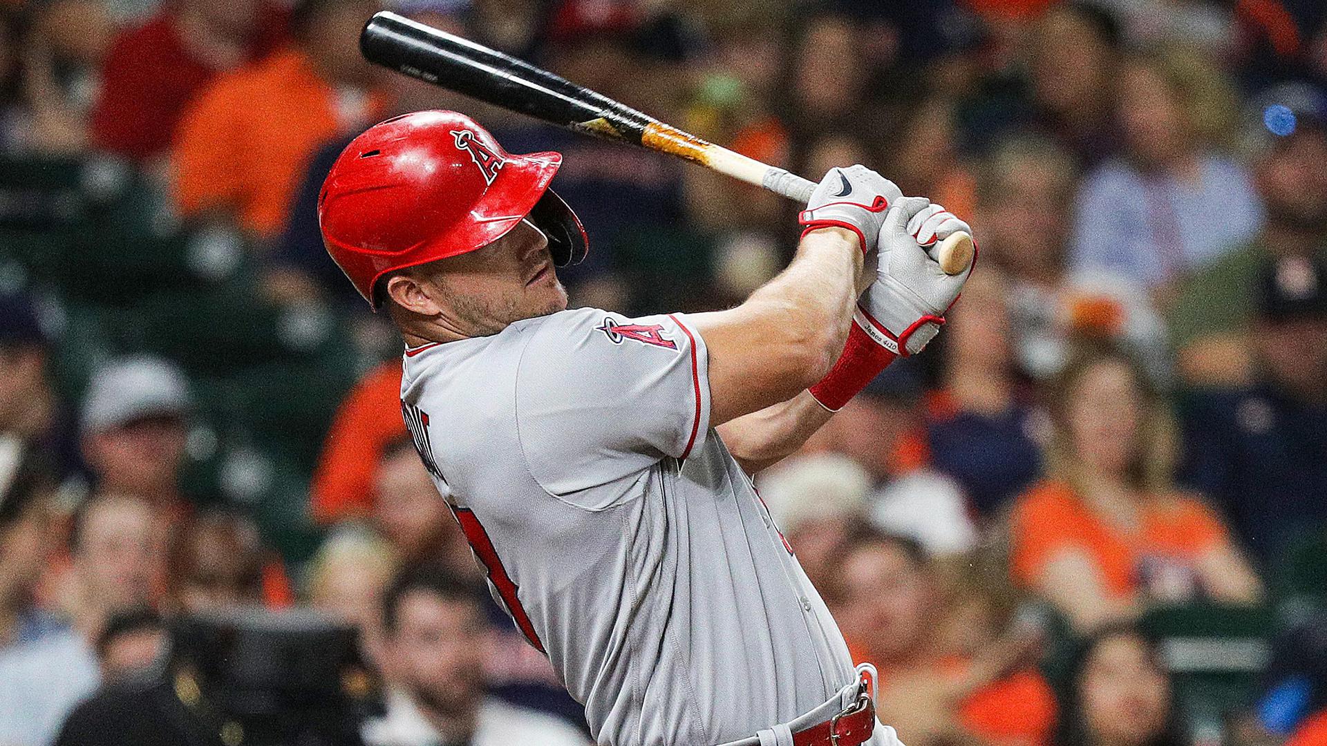 Mike Trout follows through on a swing for a home run