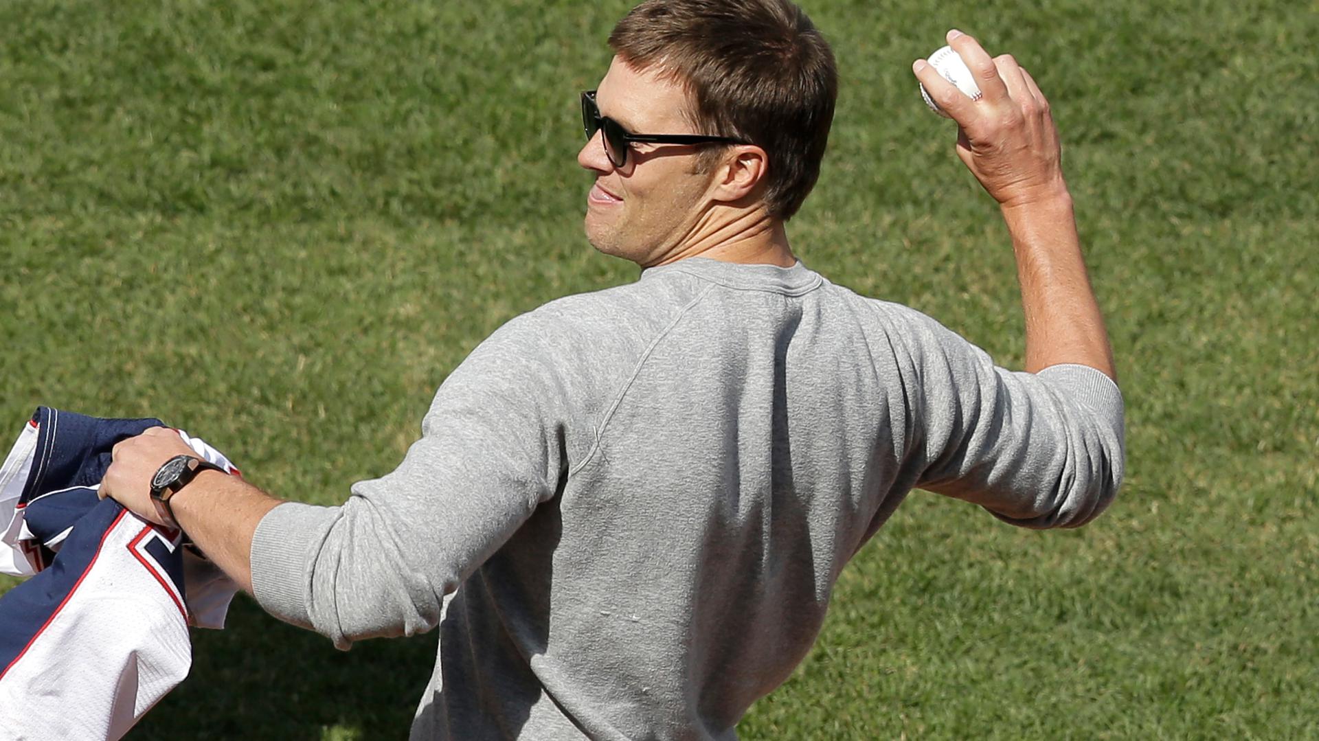 Tom Brady throwing a baseball