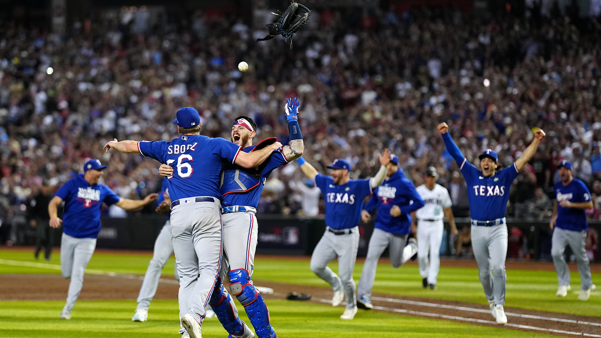 Rangers players celebrate the World Series title